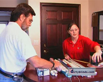 woman measuring blinds